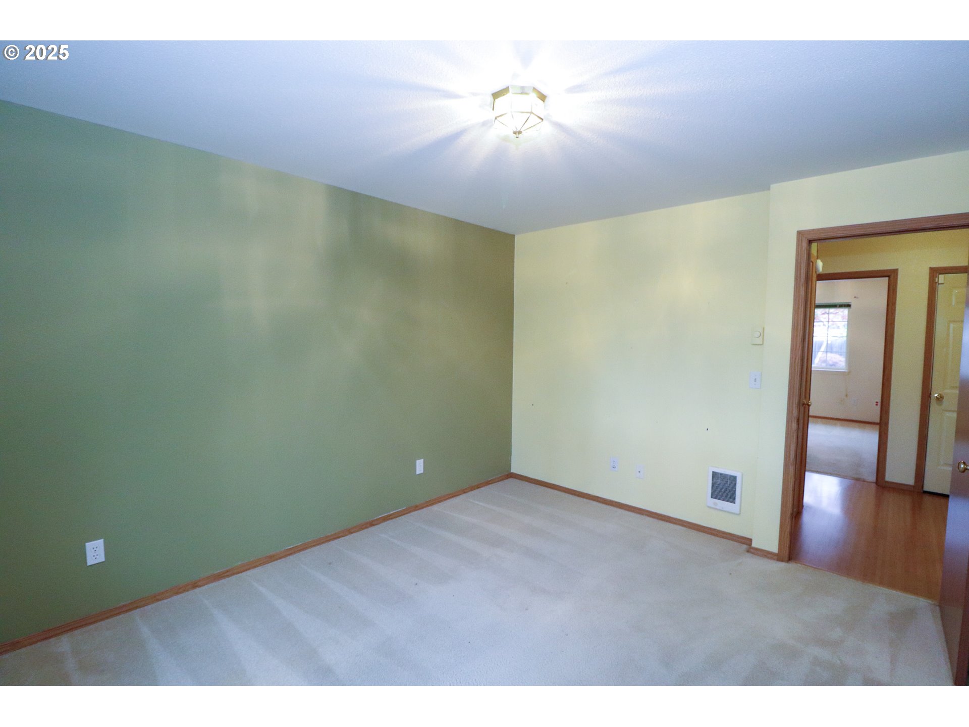 858 South 46th Street Springfield, OR 97478 - Photo 24 of 33 a view of an empty room with window and wooden floor