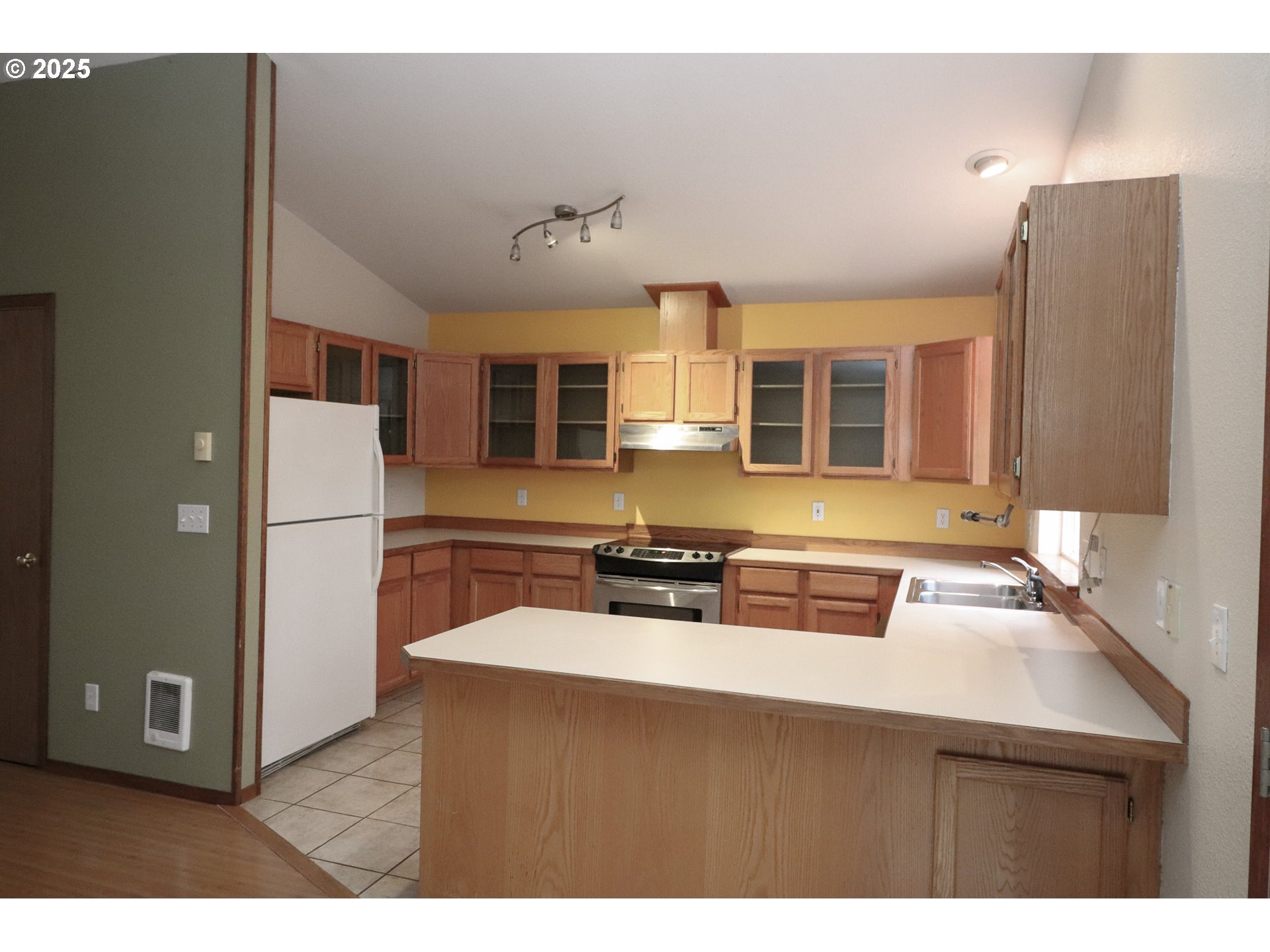 858 South 46th Street Springfield, OR 97478 - Photo 9 of 33 a kitchen with a refrigerator and a sink