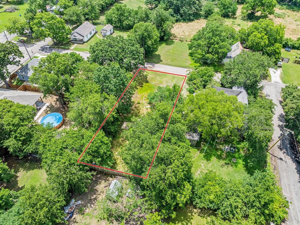 518 South 3rd Street Bonham, TX 75418 - Photo 13 of 19 an aerial view of residential house with outdoor space and trees all around