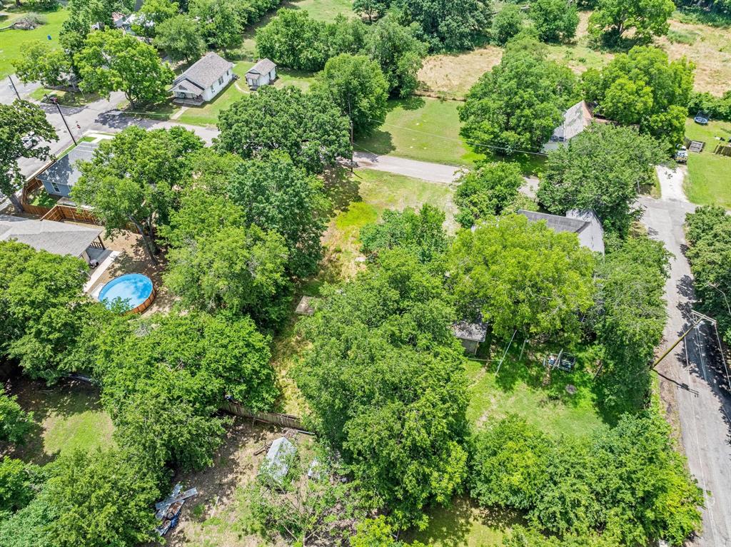 518 South 3rd Street Bonham, TX 75418 - Photo 14 of 19 an aerial view of residential house with outdoor space and trees all around