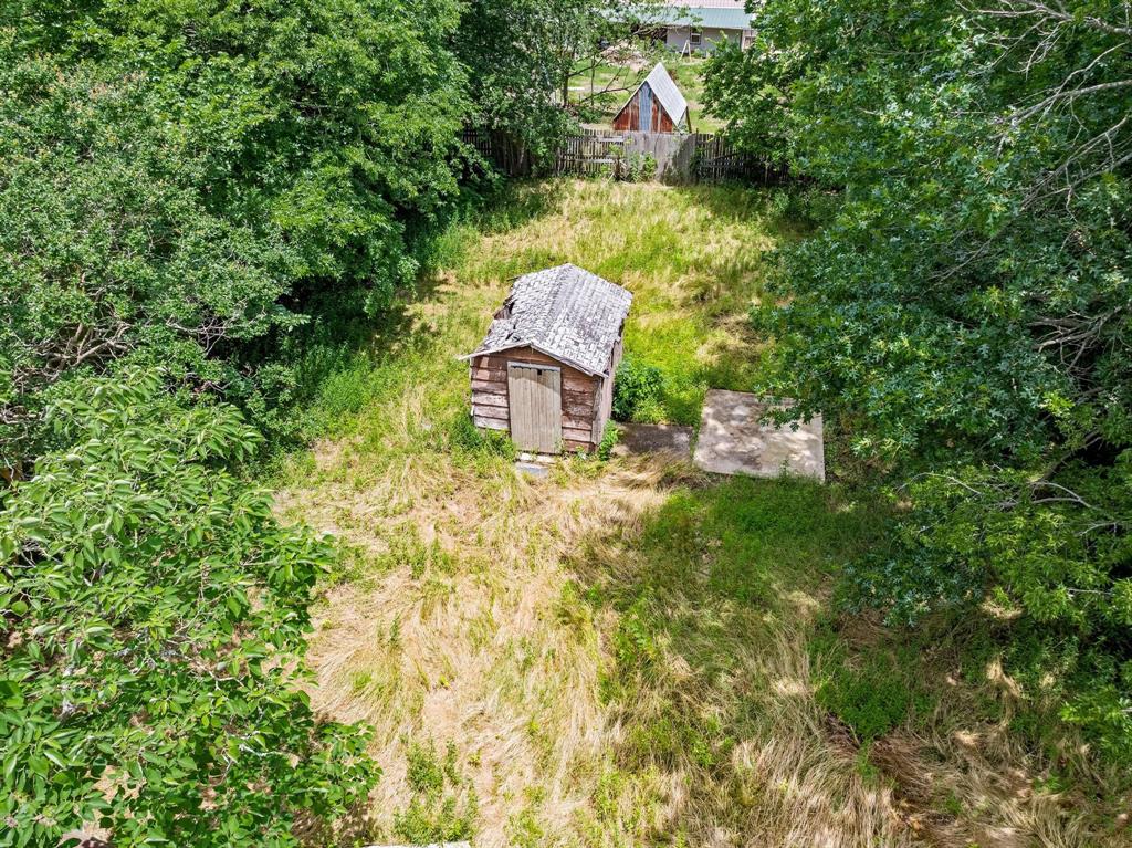 518 South 3rd Street Bonham, TX 75418 - Photo 18 of 19 a view of a house with a yard and sitting area