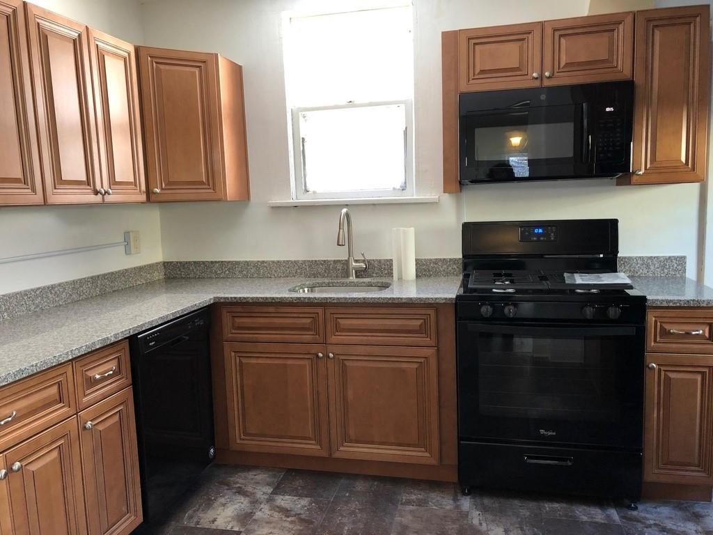 184 Provost Road Pittsburgh, PA 15234 - Photo 11 of 26 a kitchen with stainless steel appliances granite countertop a stove a microwave and oven