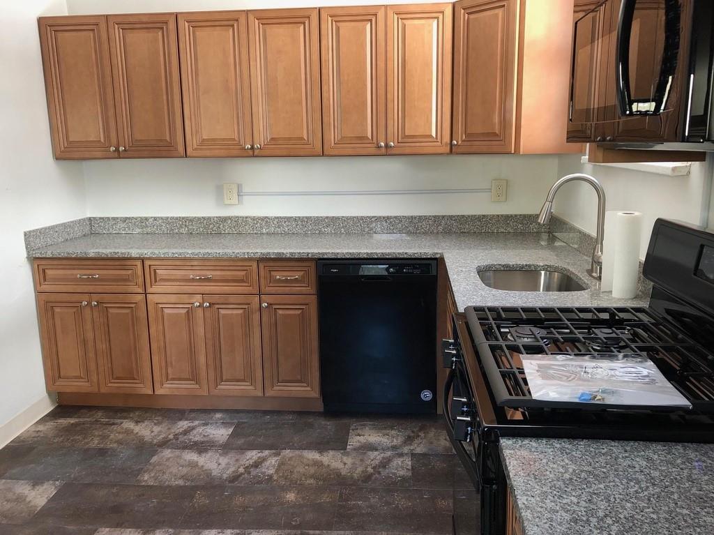 184 Provost Road Pittsburgh, PA 15234 - Photo 12 of 26 a kitchen with a stove a sink and a cabinets