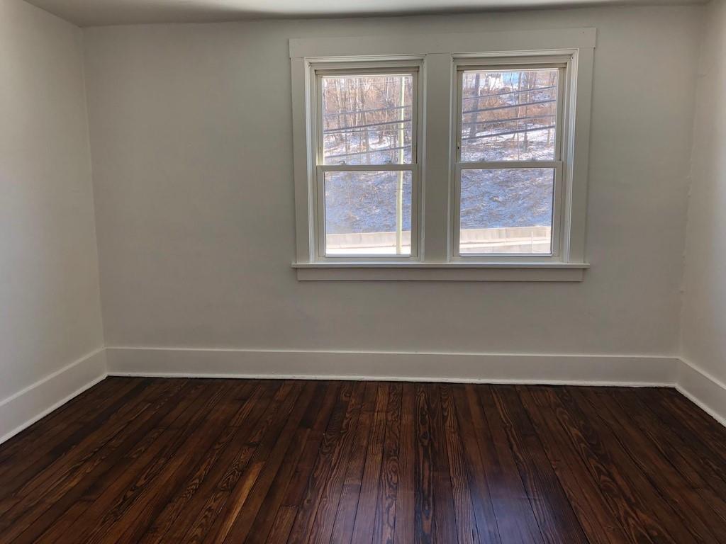 184 Provost Road Pittsburgh, PA 15234 - Photo 16 of 26 an empty room with wooden floor and windows