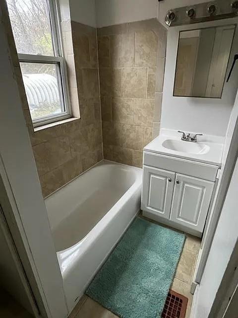 184 Provost Road Pittsburgh, PA 15234 - Photo 25 of 26 a bathroom with a sink a bathtub and a window