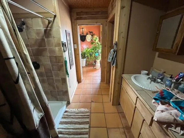 a bedroom with a bed and a dresser