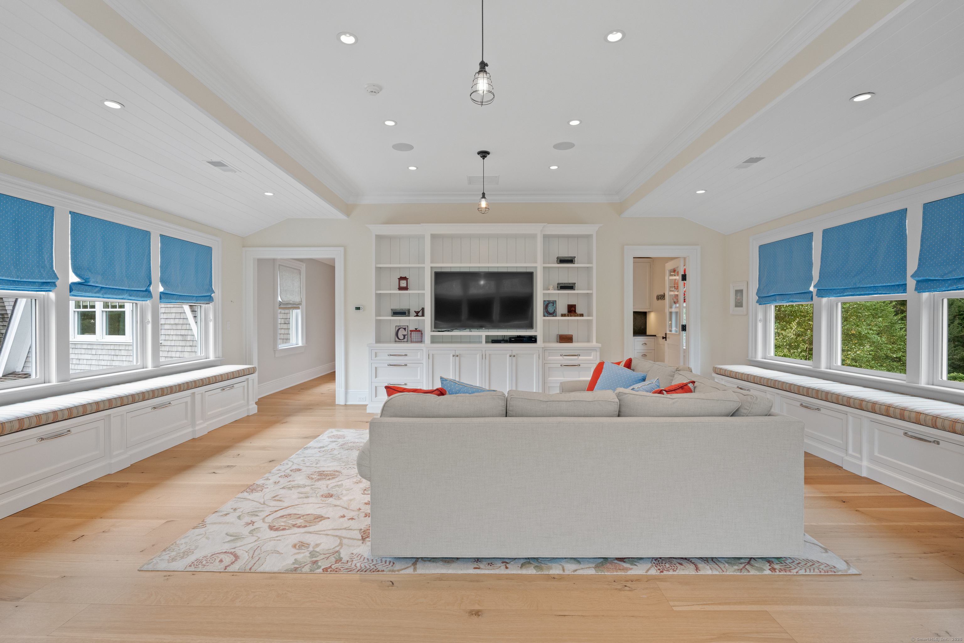 294 Maple Road Easton, CT 06612 - Photo 31 of 40 A fabulous bonus room with built-in entertainment center and flanking window seating has an adjoining craft room.