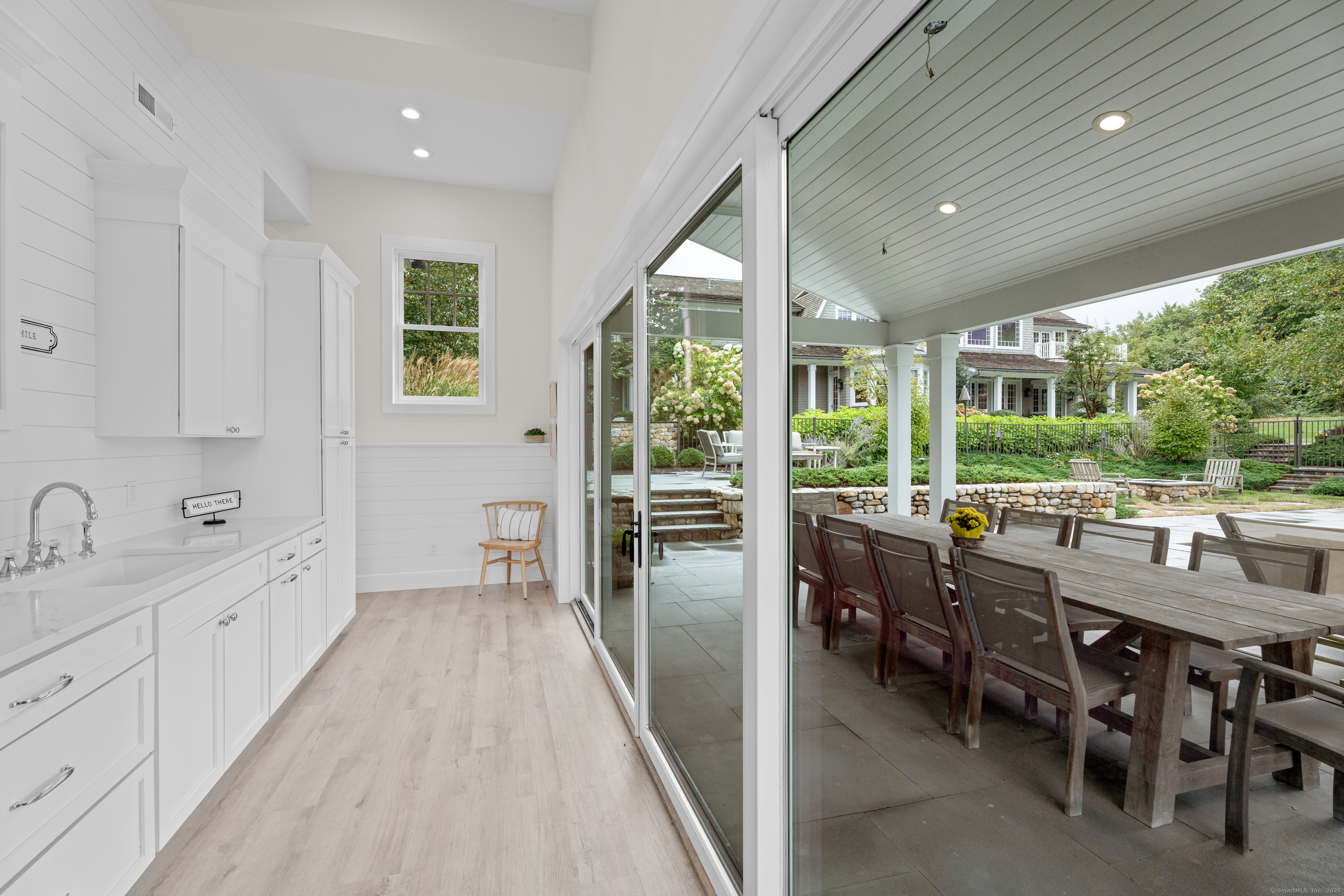 294 Maple Road Easton, CT 06612 - Photo 36 of 40 The pool house features a kitchenette, laundry, and half bath on the main level, with a recreation room, balcony, and full bathroom upstairs. A two-car garage is located beneath.