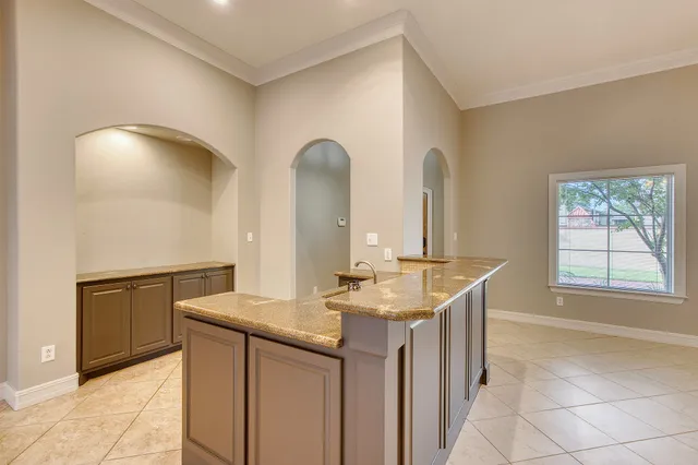 a kitchen with a sink and cabinets