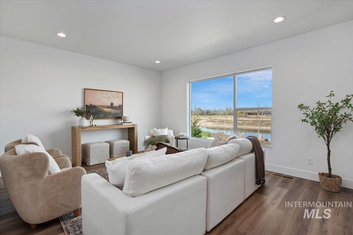 749 South Calhoun Lane Star, ID 83669 - Photo 4 of 34 Living area featuring wood finished floors, recessed lighting, and a water view