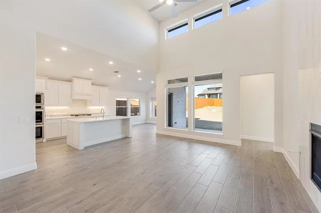 a view of kitchen with cabinets and wooden floor