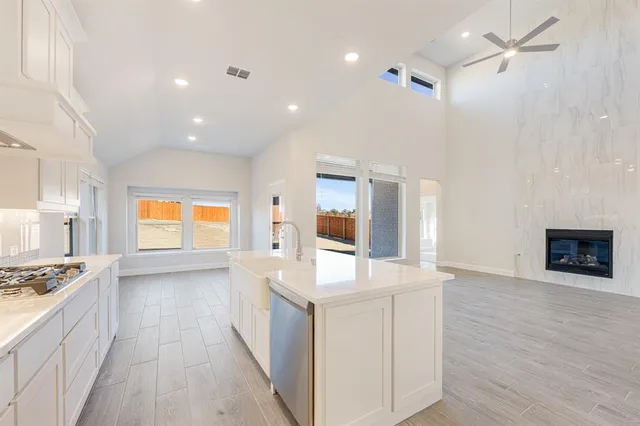 a view of kitchen with sink and microwave