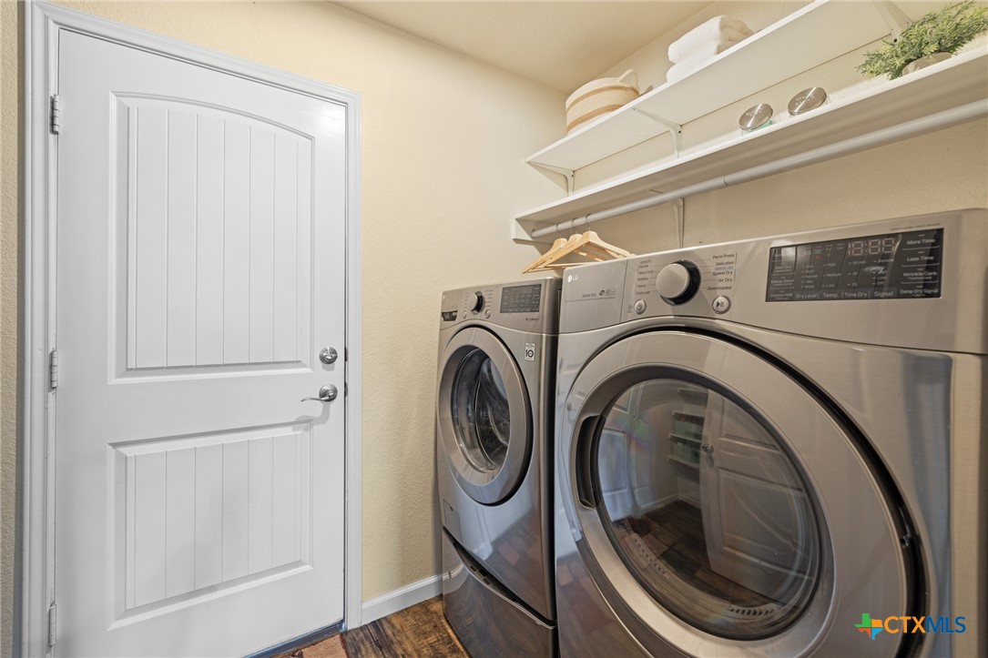 9142 Sage Loop Court Temple, TX 76502 - Photo 24 of 27 a utility room with dryer and washer