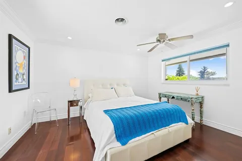 a bedroom with a bed and a table