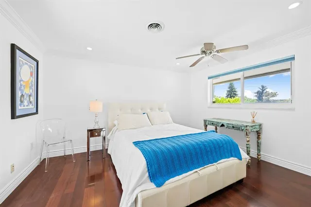 a bedroom with a bed and a table