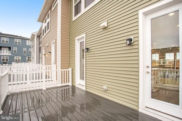 a view of a house with wooden deck