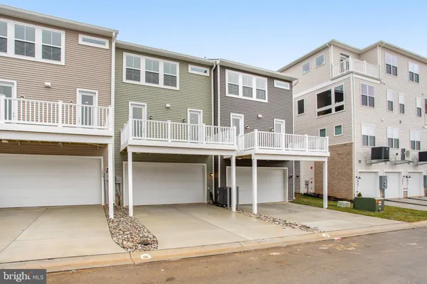 a front view of a building with a parking space