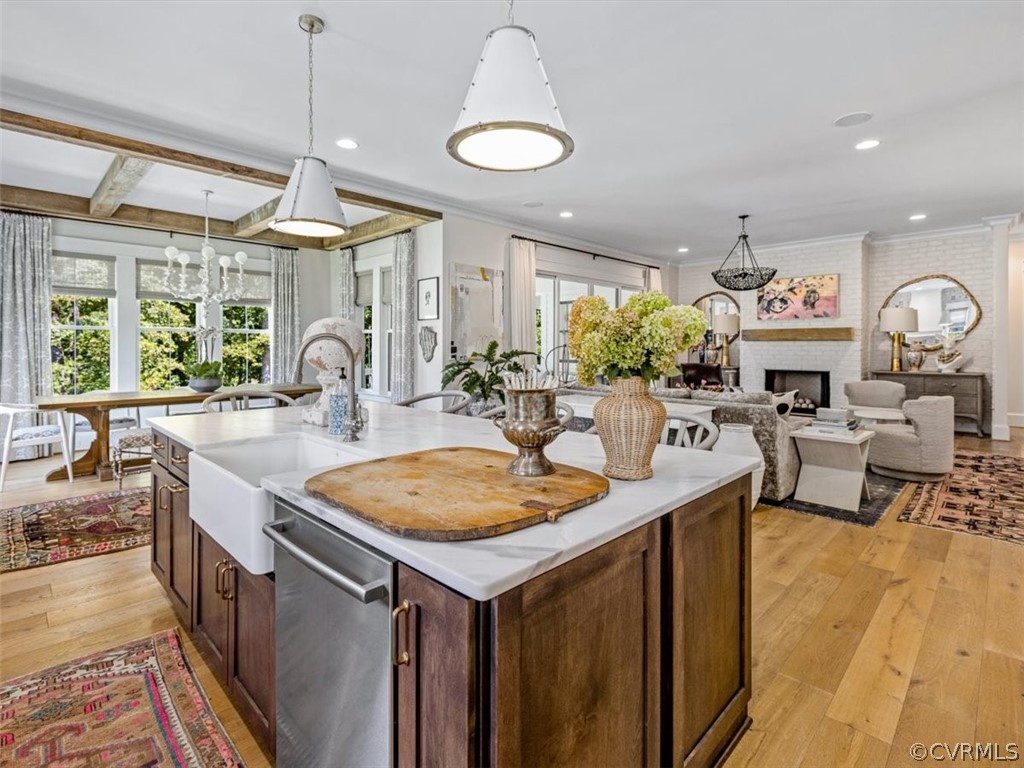 16701 Saville Chase Road Midlothian, VA 23112 - Photo 12 of 50 a kitchen with a stove a counter space a sink and living room view