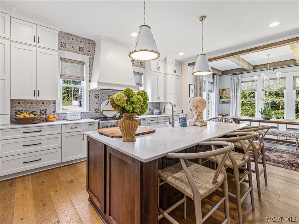 16701 Saville Chase Road Midlothian, VA 23112 - Photo 14 of 50 a kitchen with a table chairs stove and cabinets