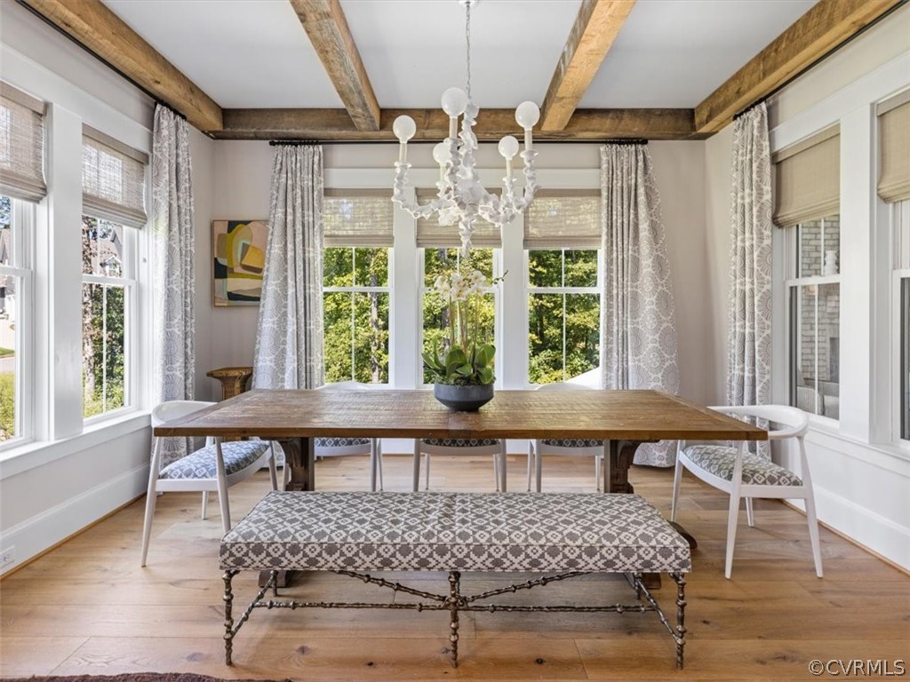 16701 Saville Chase Road Midlothian, VA 23112 - Photo 16 of 50 a view of a dining room with furniture wooden floor and a chandelier
