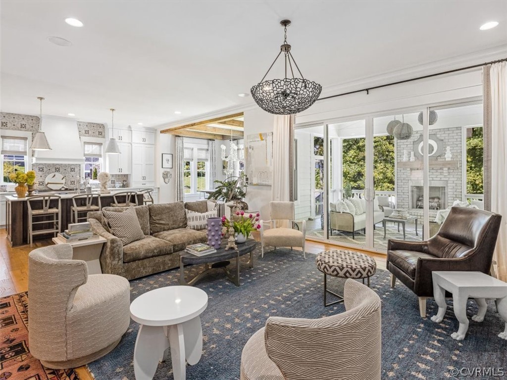 16701 Saville Chase Road Midlothian, VA 23112 - Photo 19 of 50 a living room with furniture a chandelier and a large window