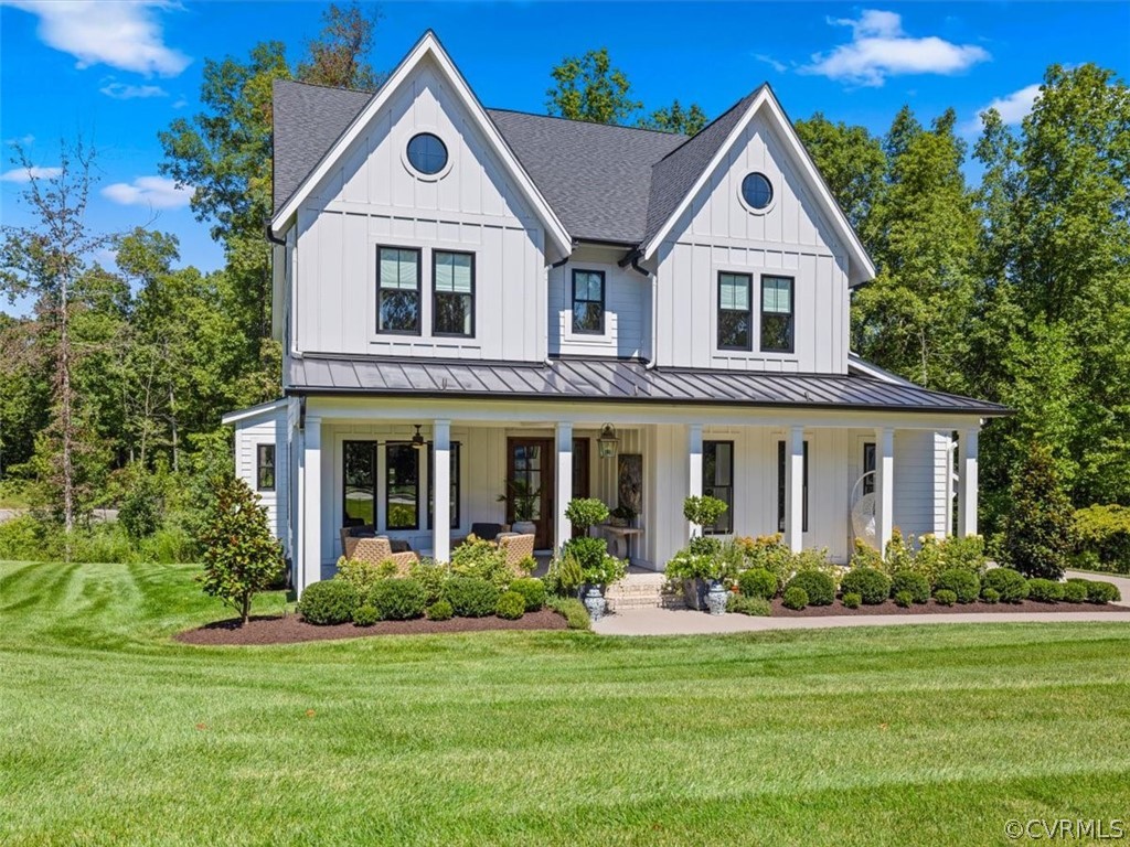 16701 Saville Chase Road Midlothian, VA 23112 - Photo 2 of 50 a front view of a house with a yard and garage