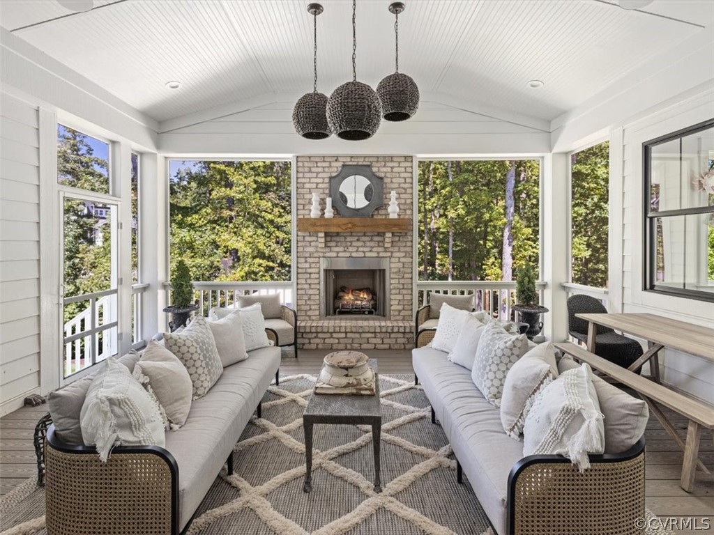 16701 Saville Chase Road Midlothian, VA 23112 - Photo 23 of 50 a living room with furniture a fireplace and a large window