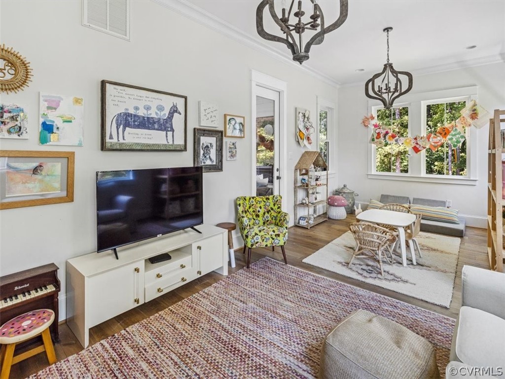16701 Saville Chase Road Midlothian, VA 23112 - Photo 27 of 50 a living room with furniture a flat screen tv and a flat screen tv