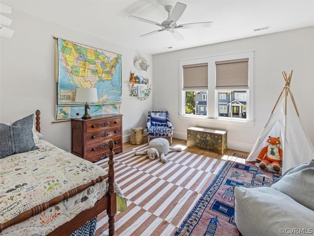 16701 Saville Chase Road Midlothian, VA 23112 - Photo 36 of 50 a bedroom with a bed and wooden floor