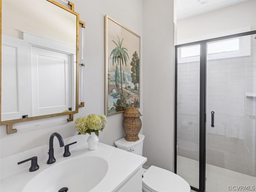 16701 Saville Chase Road Midlothian, VA 23112 - Photo 41 of 50 a bathroom with a sink a toilet and shower