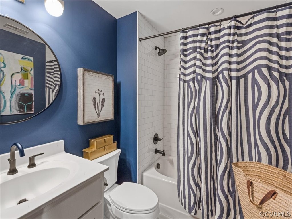 16701 Saville Chase Road Midlothian, VA 23112 - Photo 45 of 50 a bathroom with a sink a toilet and shower curtain