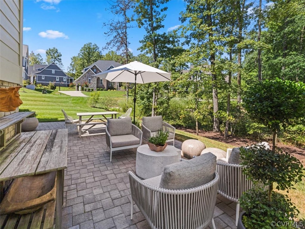 16701 Saville Chase Road Midlothian, VA 23112 - Photo 47 of 50 a view of a patio with furniture and a yard