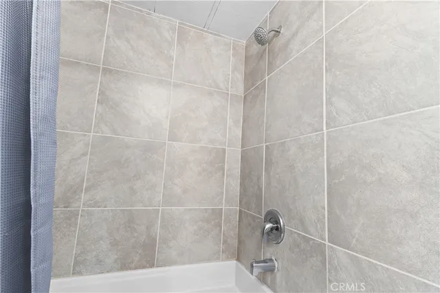 a bedroom with a bed and dresser