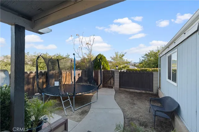 a view of a chairs and table in patio