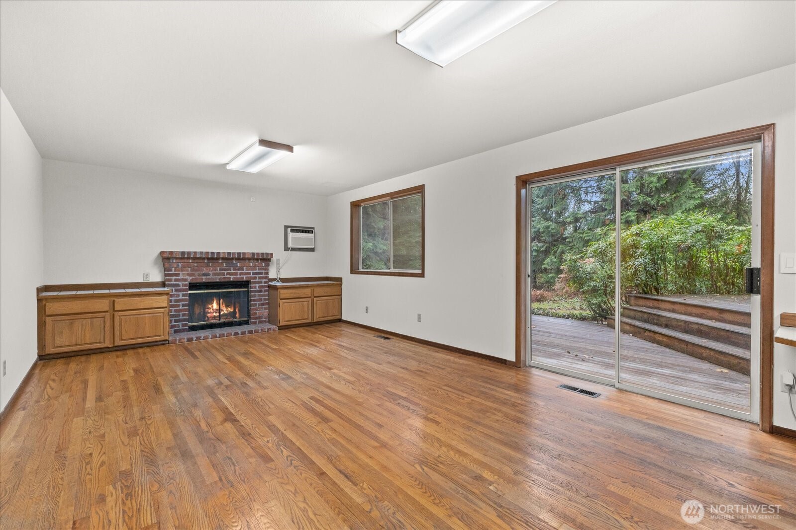 18721 Northeast 133rd Street Redmond, WA 98052 - Photo 12 of 39 a living room with furniture and a large window