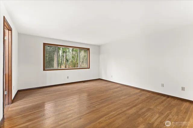 a bathroom with a sink a toilet a mirror and shower