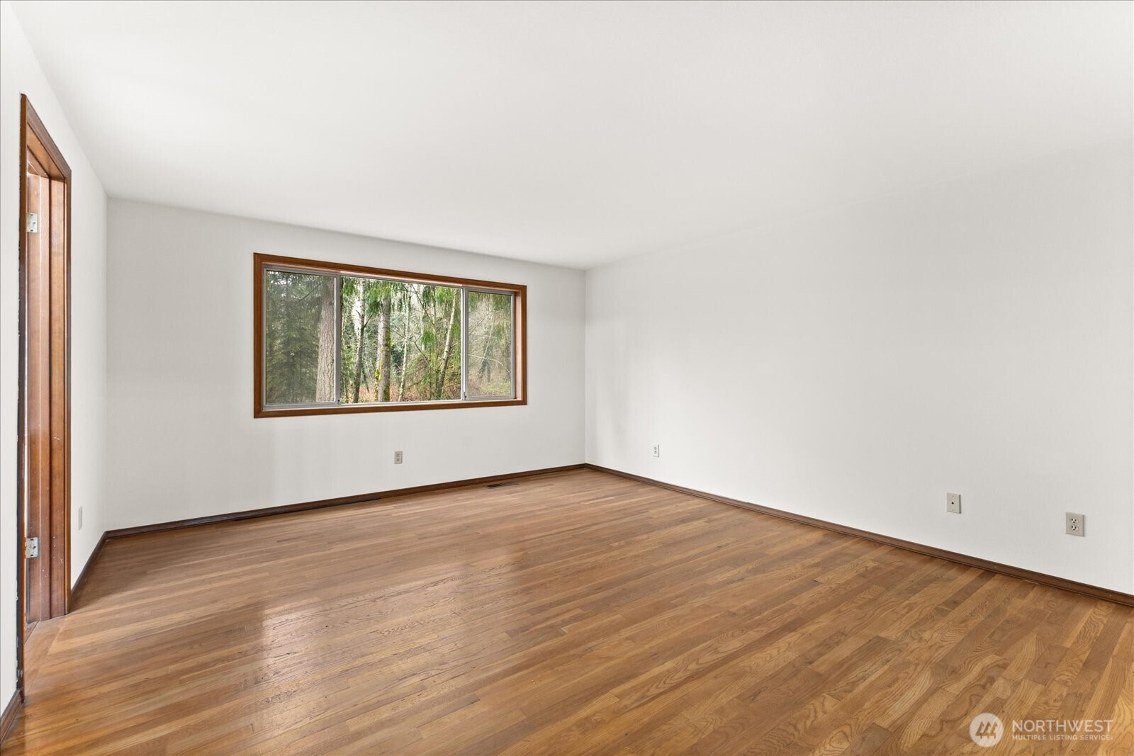 18721 Northeast 133rd Street Redmond, WA 98052 - Photo 14 of 39 an empty room with wooden floor and windows