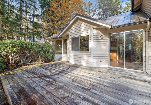 an aerial view of a house with a yard and garden