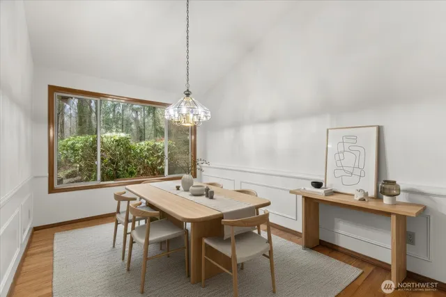 a view of a livingroom with furniture window and wooden floor