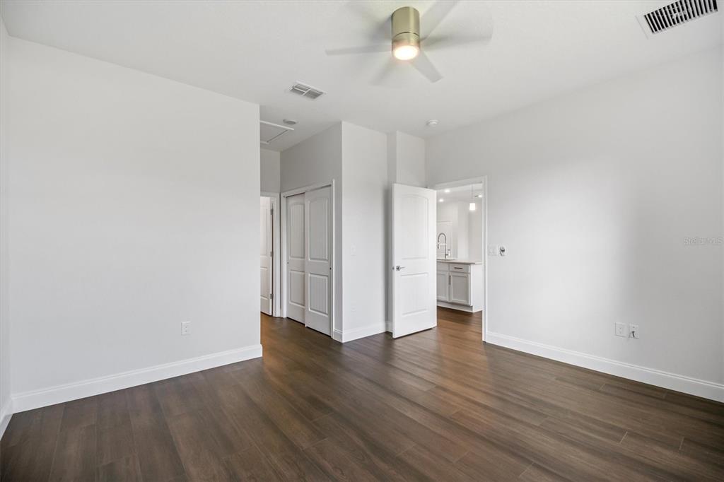 52 Pershing Lane Palm Coast, FL 32164 - Photo 15 of 37 a view of an empty room with wooden floor