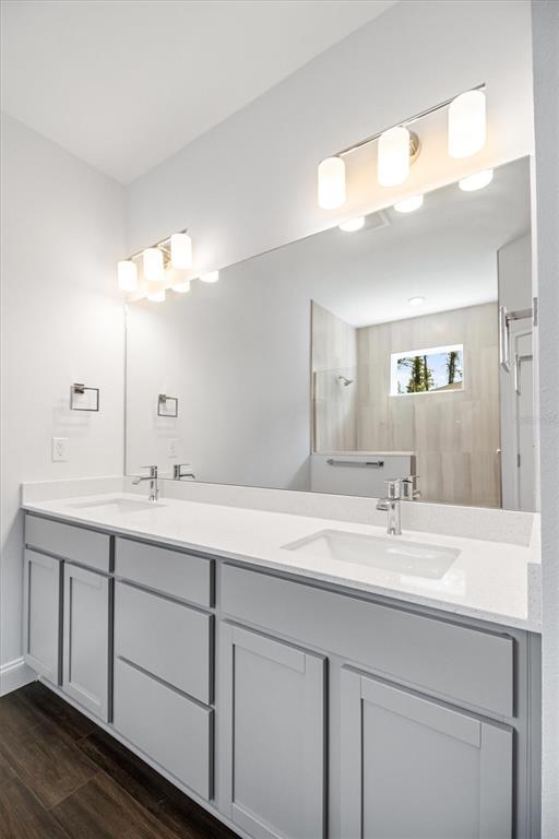 52 Pershing Lane Palm Coast, FL 32164 - Photo 17 of 37 a bathroom with a sink double vanity and a mirror