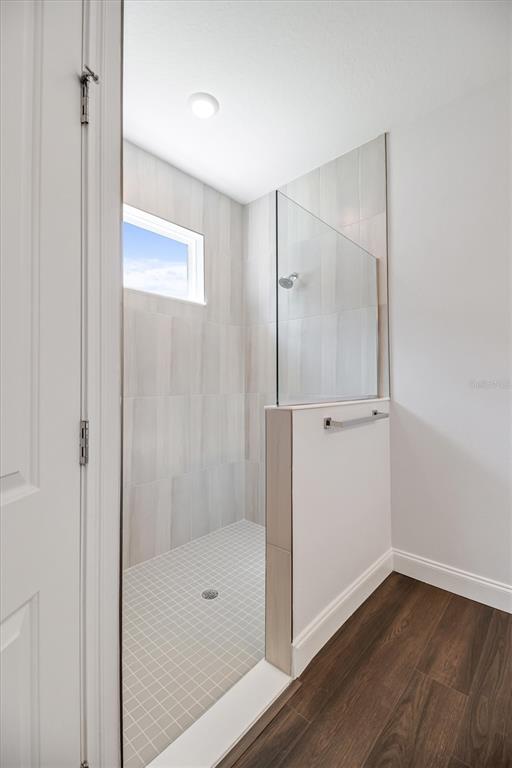 52 Pershing Lane Palm Coast, FL 32164 - Photo 18 of 37 a bathroom with a glass shower door