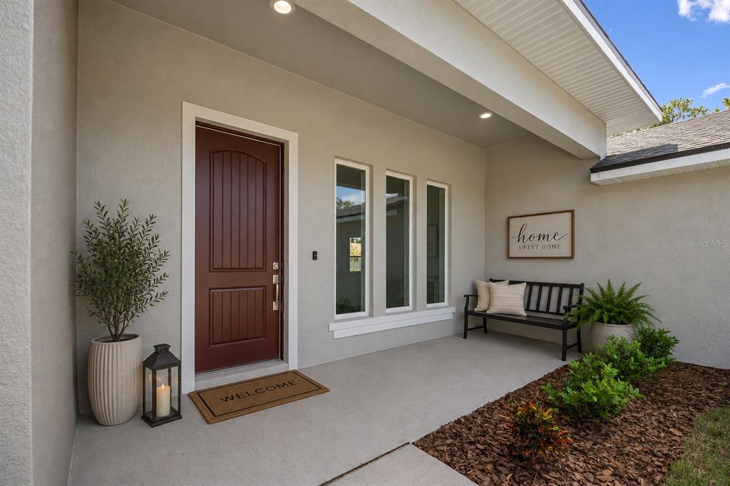 52 Pershing Lane Palm Coast, FL 32164 - Photo 2 of 37 a view of outdoor space with deck and furniture
