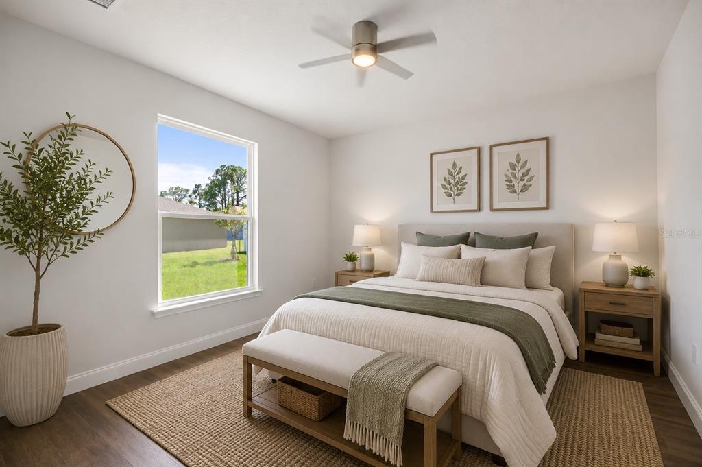 52 Pershing Lane Palm Coast, FL 32164 - Photo 23 of 37 a bedroom with a bed and a window