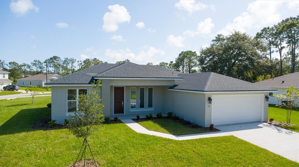 52 Pershing Lane Palm Coast, FL 32164 - Photo 3 of 37 a view of a house with a backyard
