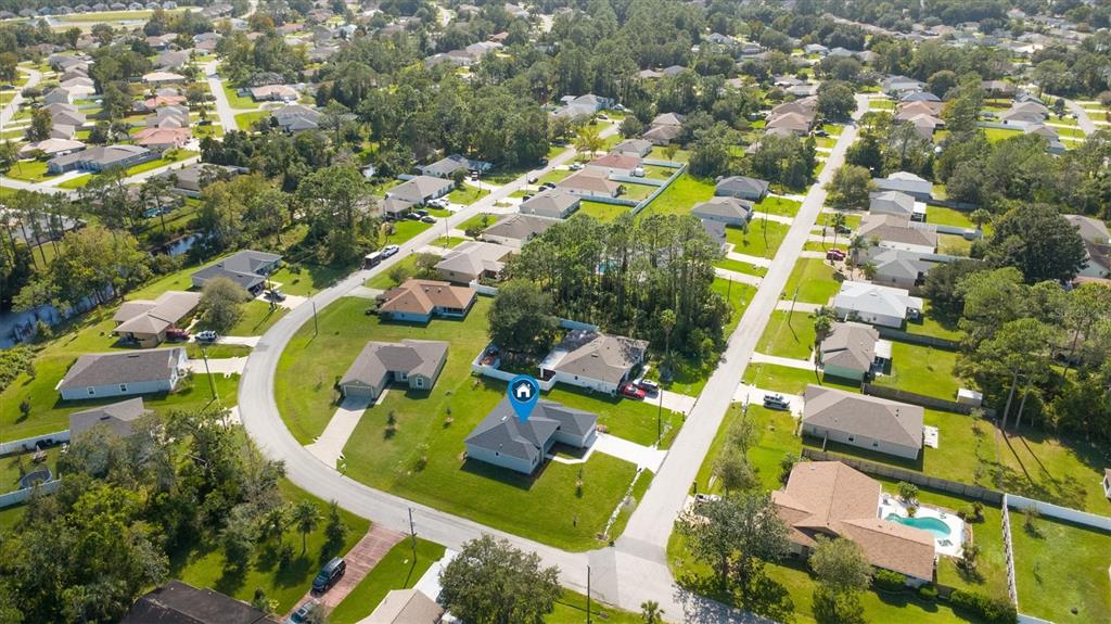 52 Pershing Lane Palm Coast, FL 32164 - Photo 33 of 37 an aerial view of residential house with outdoor space and swimming pool