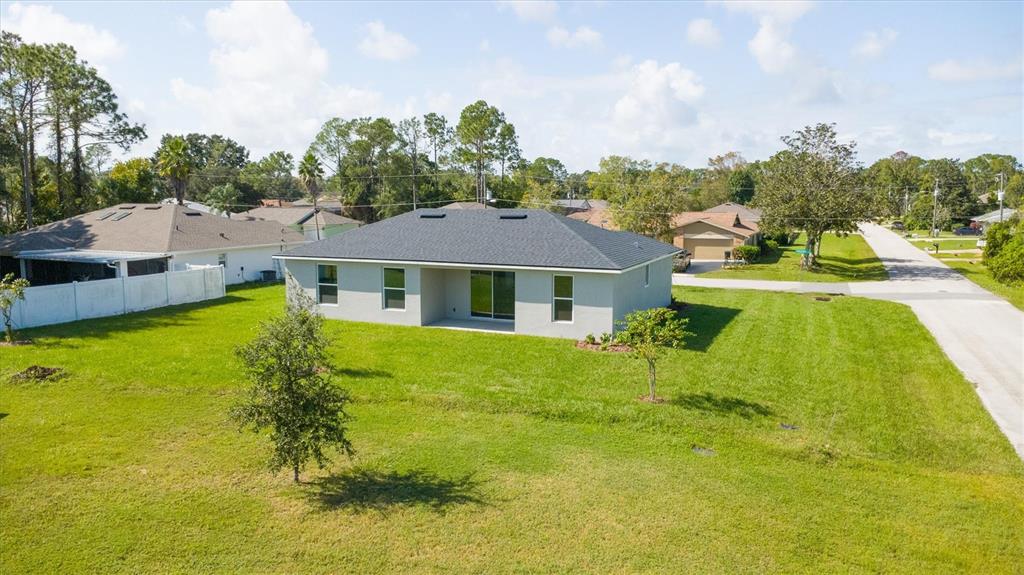 52 Pershing Lane Palm Coast, FL 32164 - Photo 34 of 37 a house with swimming pool in front of it