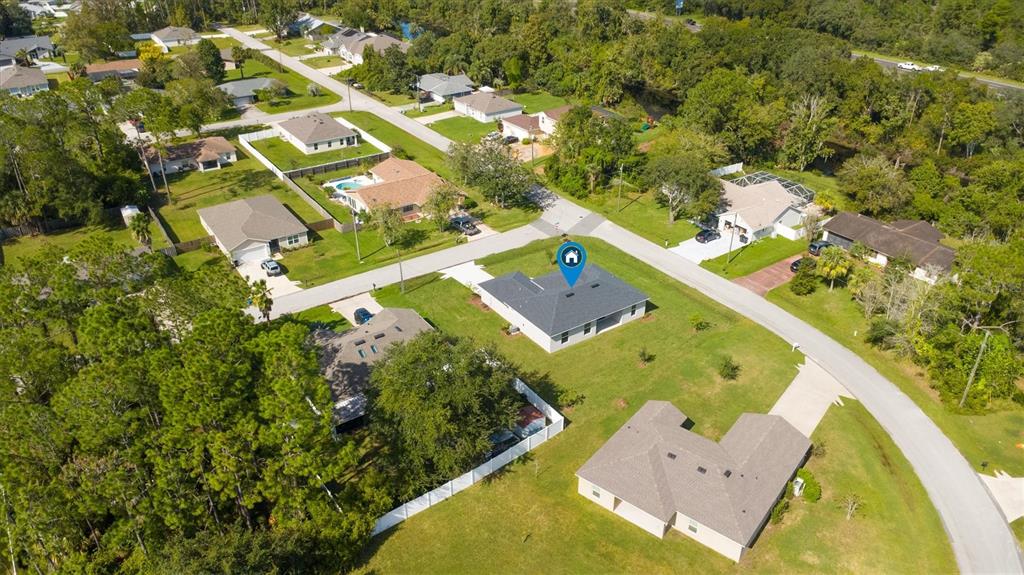 52 Pershing Lane Palm Coast, FL 32164 - Photo 35 of 37 an aerial view of a house with a swimming pool