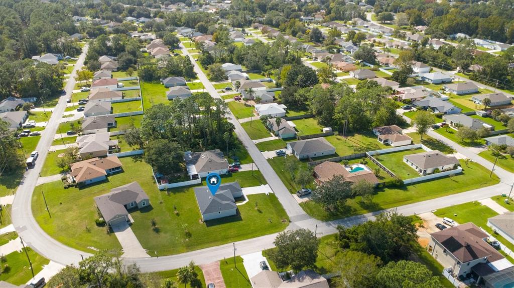 52 Pershing Lane Palm Coast, FL 32164 - Photo 36 of 37 an aerial view of residential houses with outdoor space and swimming pool