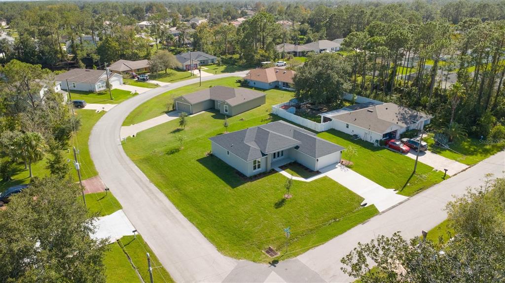 52 Pershing Lane Palm Coast, FL 32164 - Photo 5 of 37 an aerial view of residential houses with outdoor space